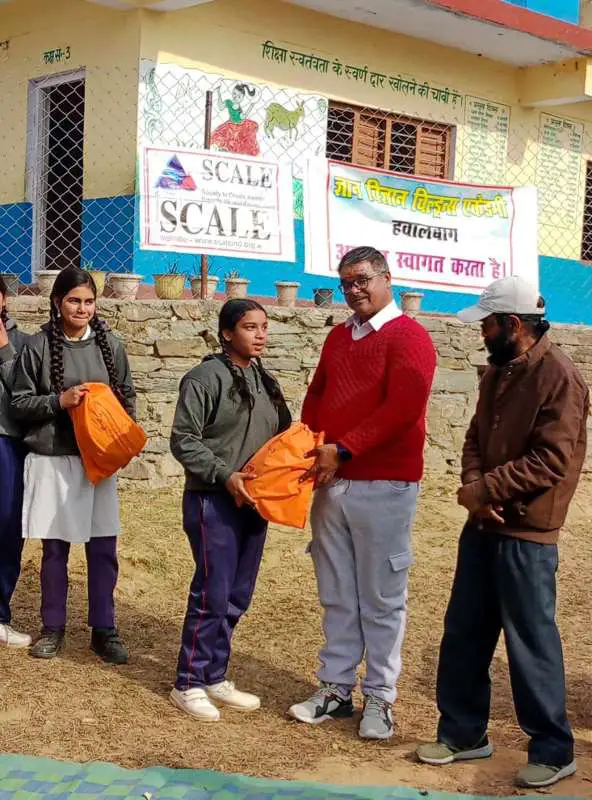 Initiative of Scale NGO of Gurgaon – Warm dresses given to children of Gyan Vigyan Children Academy