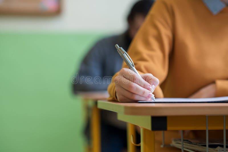 students taking exam classroom education test literacy concept cropped shot hand detail students taking exam classroom 113036595 optimized 1763902337