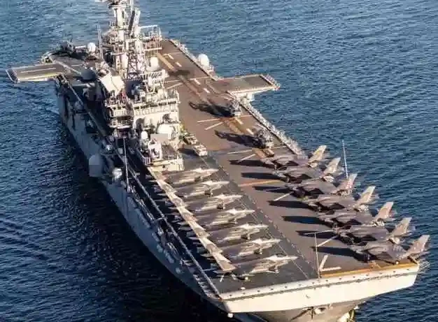 Iran claims attack on American aircraft carrier USS Tripoli LPG tanker stuck in Hormuz Strait