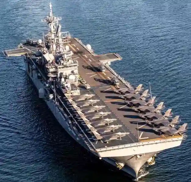 Iran claims attack on American aircraft carrier USS Tripoli LPG tanker stuck in Hormuz Strait