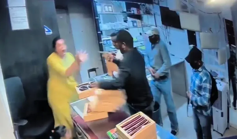 Woman Jewelry Shop Owner Jumps Over Counter to Chase Away 6 Armed Robbers